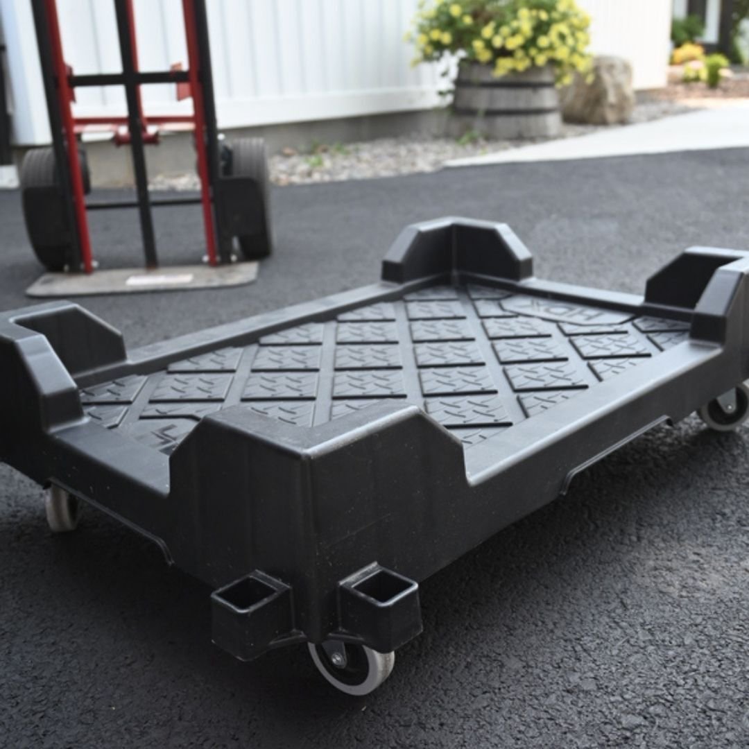 Black dolly pictured on customers driveway without any totes stacked on top 